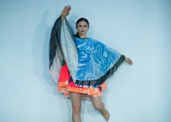 Rebecca Warner dances with the upstage wall. Photo by Ian Douglas.