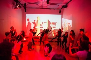 Marguerite Hemmings leads the entire room in a dance. 