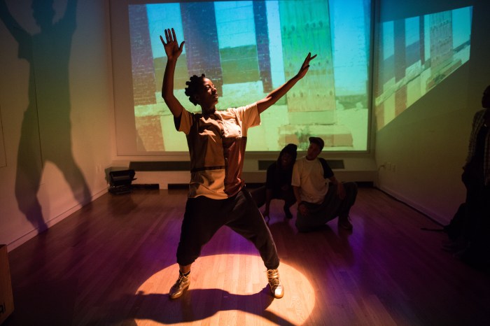 Marguerite Hemmings, front, greets attendees. Italy Welton (Back Left) and Courtney Cook look on. 